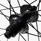 WHEEL, WH-MT620-B-29, F&R:24H, FOR 12S, F:15/R:12MM E-THRU, TUBELESS, OLD:110/148MM, BLACK, W/ STD STICKER, CL DISC
